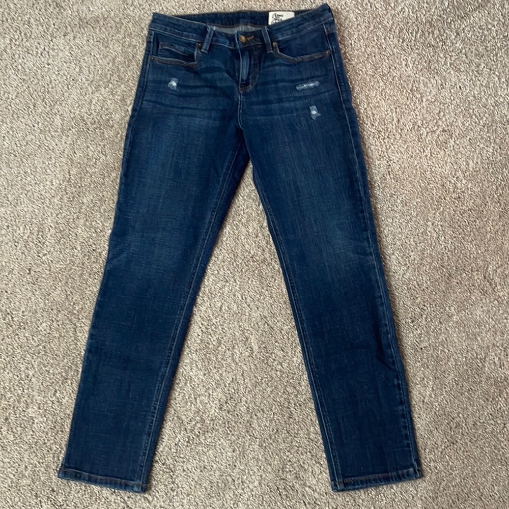 Skinny jeans with light distressing.